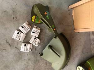 lot 101 image: Electric Lawnmower with Weed wacker attachment