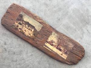 lot 104 image: Vintage photos of houses  on piece of drift wood