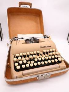 lot 42 image: Vintage Smith Corona Silent Super 5T Typewriter Sand with Case and Brochure