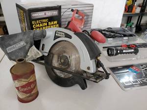 lot 55 image: Chain Saw Sharpener Tool and Corvette Decor License Plate