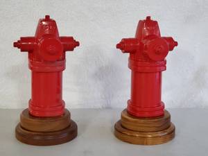 lot 95 image: (2) Red Cast Iron Fire Hydrants on Wooden bases