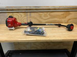 lot 34 image: TORO 2-Cycle 25.4cc Attachment Capable Curved Shaft Gas String Trimmer
