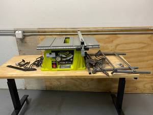 lot 55 image: RYOBI 15 Amp 10 in. Expanded Capacity Table Saw With Rolling Stand