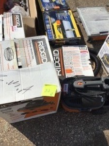lot 22 image: PALLET WITH RIGID VACUUMS AND TILE SAWS CUSTOMER RETURNS  and some for parts only SEE PICS