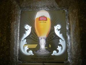 lot 13 image: NEW IN BOX ONLY OPENED FOR PICTURES - STELLA ARTOIS LED LIGHT (WORKS AS SEEN IN PICTURE BUT WILL NEED CORD PICTURED) - AWESOME PIECE FOR THE CAVE - APPROX 16 BY 17 - SEE PICTURES