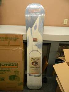 lot 51 image: NEW IN BOX ONLY OPENED FOR PICTURES - TITOS VODKA SNOWBOARD DISPLAY ADVERTISING SIGN  - ANOTHER AWESOME PIECE FOR THE CAVE - APPROX 61 LONG - SEE PICTURES