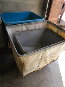 lot 132 image: COMMERCIAL LAUNDRY CARTS PLUS A SPRING LOADED SANI TRUCK