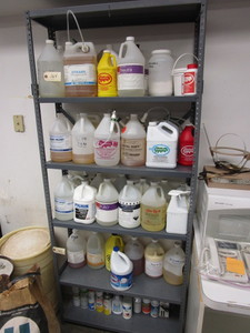 lot 165 image: LAUNDRY AND DRY CLEANING CHEMICALS PLUS A STURDY SHELF