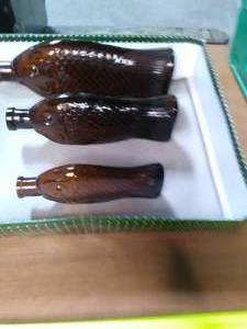lot 59 image: Vintage Brown Glass Fish Bottles S...