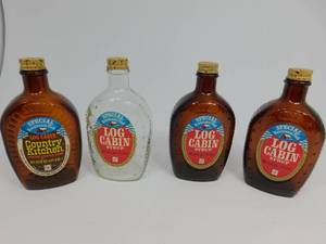 lot 106 image: 4 Vintage Log Cabin Syrup Flasks