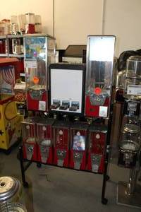 lot 3 image: Eagle Bulk Candy and Sticker Dispenser 8-Head Rolling Cart $.25$.50