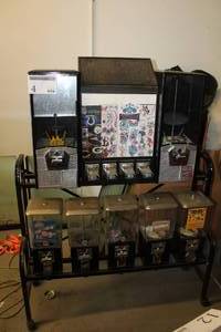 lot 4 image: Northwestern Bulk Candy and Sticker Dispenser 8-Head Rolling Cart $.25$.50