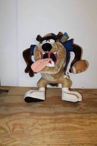 lot 78 image: Warner Bros. Looney Tunes Taz Tazmanian Devil Football Player Stuffed Animal