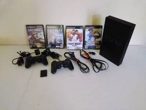 lot 33 image: PlayStation 2 with Games