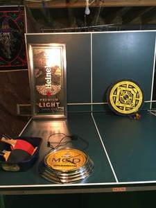lot 253 image: Ping Pong Table with Paddles and Balls Dart Board and Beer Decor