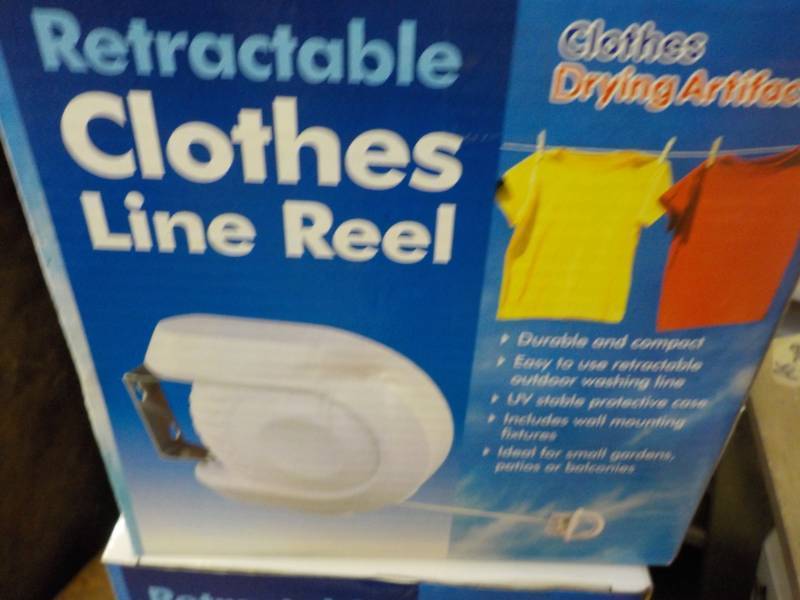lot 10 image: Set of 2 Retractable Clothes Line R... End of K