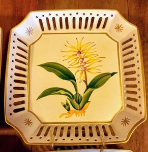 lot 62 image: Set of Four Painted Decorative Floral Wall Plates