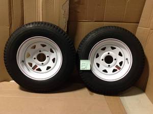 lot 51 image: Martin Wheel 530-12 Load Range C 4-Hole Custom Spoke Trailer Tire and Wheel Assembly &nbspin good condition