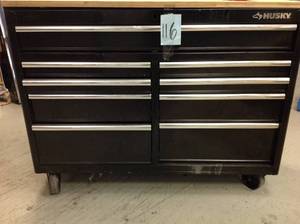 Husky 52 in. W 9-Drawer, Deep Tool Chest Mobile Workbench in Gloss Black with Hardwood Top have some scrtachs and not switch lock