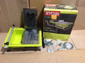 lot 27 image: RYOBI 7 in. 4.8 Amp Tabletop Tile Saw &nbspin good condition