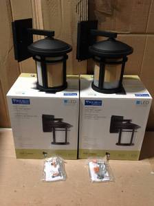 lot 78 image: Set of 2 Wish Collection 1-Light 10.4 in. Outdoor Textured Black LED Wall Lantern Sconce by Progress Lighting not used