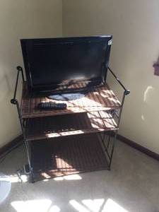lot 41 image: Dynex LCD TV with 31 x 27 x 18 Wicker Stand