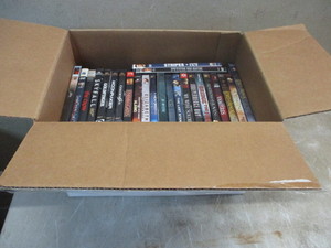 lot 74 image: Box of DVDs  24 DVDs of various genre.
