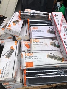 lot 56 image: Pallet with assorted tile cutters, different sizes, various conditions some new some used