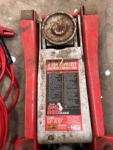 lot 33 image: Torin Big Red Jack, Ramps, Jumper Cables, and More