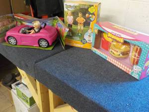 lot 27 image: Barbie Car and Doll, Kidoozie Pogo ...