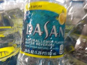 lot 251 image: 24 Bottles Dasani Lemon Flavored Wa...