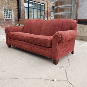 lot 7 image: Burgundy Wine Broyhill Sleeper Sofa with Brass Tack Detail