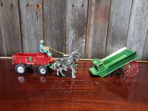 Two Vintage Cast Iron Wagons with Horses and Driver