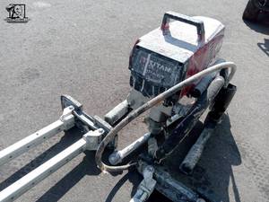 lot 130 image: Adjustable Drywall Stilts & Titan 440 Impact 3300 PSI .54 GPM Electric Airless Sprayer