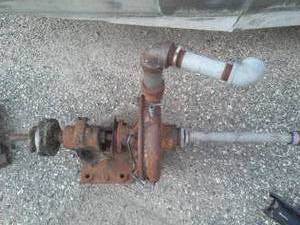 lot 20 image: Belt driven pump, steam punk, wood pulley wheels.