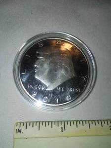 lot 120 image: Trump silver colored Coin  Liberty.