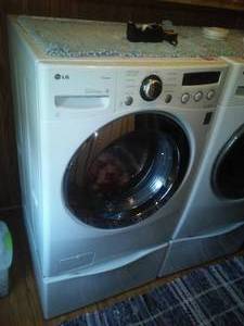 lot 208 image: Like New LG Front Load Washer with pedestal.