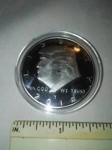 lot 183 image: Donald Trump Silver colored Coin Presidential seal.