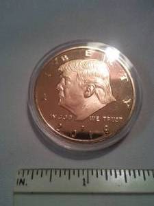 lot 184 image: Donald Trump Gold Colored Coin, Presidential Seal.