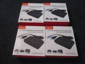 lot 91 image: 4- 3 in 1 GC Controller Adapters...