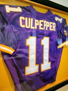 lot 176 image: Framed Vikings Jersey
