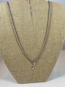 lot 29 image: Sterling Silver Music Note Necklace