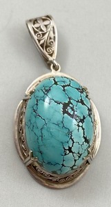 lot 52 image: Sterling Silver & Turquoise Pendant