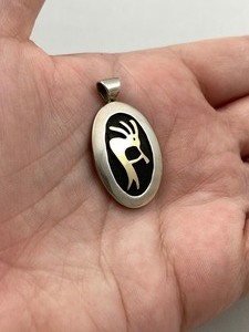 lot 56 image: M.M Rogers Sterling & 14k Gold Pendant