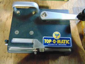 lot 101 image: Top-O-Matic Cigarette Machine and Tray of Lighters