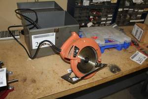 lot 266 image: Skilshop 7-14in. Circular Saw, Case. Extra Blades
