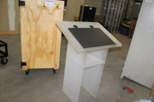 lot 291 image: Frosted Acrylic Podium In Rolling Wood Case