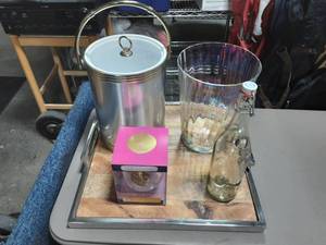 lot 2 image: Chrome & Wood Serving Tray, Ice Bucket With Tongs, Glass Bottle & Bucket, Wine Glass (Holds Full Bottle Of Wine)