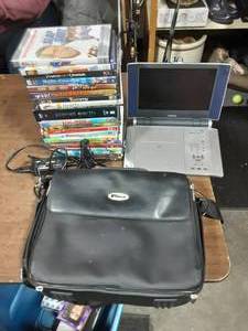 lot 11 image: Portable DVD Player & Assorted DVDs With Case