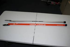lot 1 image: (2) Under Armour Mens Lacrosse Handles